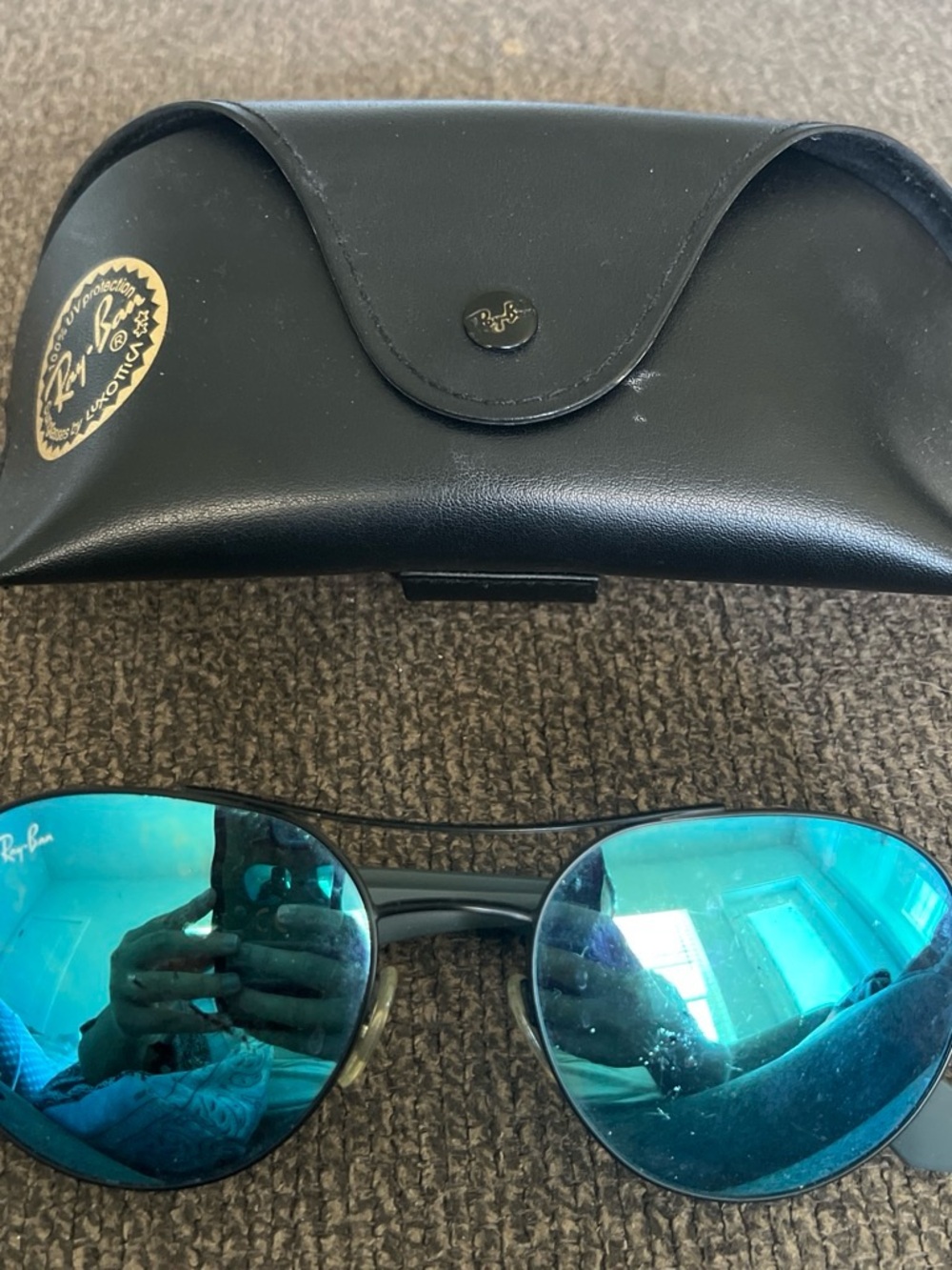 Ray-Ban Black Frame Sunglasses with Blue Mirrored Lenses